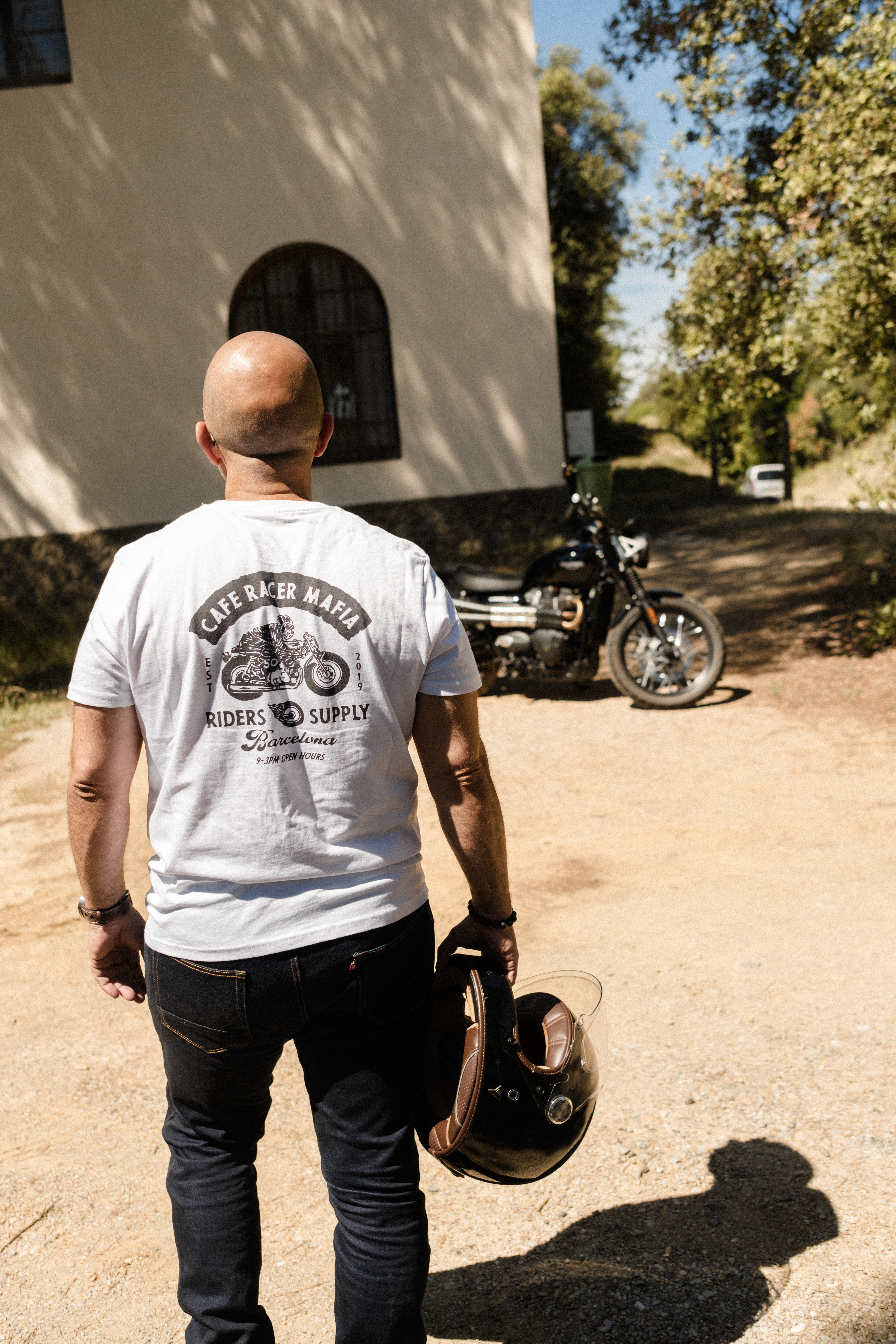 Cafe Racer Mafia Riders Supply tee on a modern classic ride